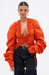 IN IT TO WIN IT RUCHED BLOUSE